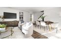Open concept dining area with seating for six and adjacent living space at 7010 Sycamore Grove Ct, Charlotte, NC 28227