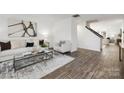 Bright living room with hardwood floors and modern decor at 7010 Sycamore Grove Ct, Charlotte, NC 28227