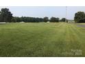 Open pasture land with trees in background at 7104 Sandy Smith Rd, Marshville, NC 28103