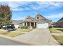 Attractive brick home with a two-car garage and manicured lawn at 8243 Bretton Woods Dr, Charlotte, NC 28227