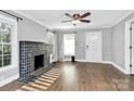 Spacious living room with hardwood floors, fireplace, and neutral decor at 835 Belmont Ave, Charlotte, NC 28205