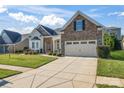 Ranch style home with stone and siding exterior, two-car garage at 9124 Longvale Ln, Charlotte, NC 28214