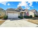 Two-story house with a white garage door and American flag at 1009 Chapman St, Indian Trail, NC 28079