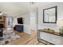 Bright living room with hardwood floors and a fireplace at 1147 Bloom Wood Ln, Matthews, NC 28105