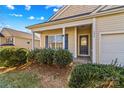 Front entry with a blue door and stone porch at 124 Zolder Ln # 15, Mooresville, NC 28117