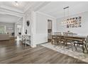 Spacious dining room with hardwood floors, a chandelier, and access to the kitchen at 1503 Brooksland Pl, Waxhaw, NC 28173