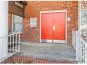 Apartment building entrance with red doors and a brick facade at 2146 S Main St, Kannapolis, NC 28081