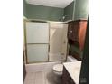 Bathroom with shower/tub combo and wood cabinet at 219 W Edison Dr, Statesville, NC 28625