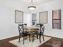 Charming dining area with wooden table and four chairs at 224 N Poplar St # 22, Charlotte, NC 28202