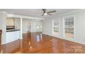 Hardwood floor living room with access to kitchen and backyard at 2241 Londonderry Dr, Gastonia, NC 28056