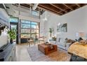 Bright living room with large garage door opening to patio at 3572 Artists Way, Charlotte, NC 28205