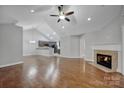 Spacious living room with hardwood floors, fireplace, and high ceilings at 4829 Boomerang Way, Charlotte, NC 28269