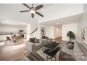 Open living room, kitchen, and dining area with hardwood floors and high ceilings at 509 Tallwood Ct, Charlotte, NC 28216