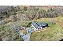 Wide aerial view showing home, driveway, and surrounding landscape at 535 Grampian Rd, Mt Ulla, NC 28125