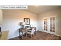 Home office with hardwood floors and French doors at 548 Zermatt Ct, Monroe, NC 28112