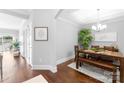 Bright dining room with hardwood floors, modern decor, and a large window at 6605 Central Pacific Ave # 301A, Charlotte, NC 28210