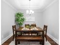 Dining room with stylish decor, a modern chandelier, and a large dining table at 6605 Central Pacific Ave # 301A, Charlotte, NC 28210