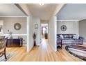 Spacious hallway featuring hardwood floors and decorative touches connecting living spaces at 7832 Winterset Dr, Charlotte, NC 28270