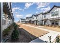 Townhome community featuring similar-style homes, landscaping, and walkways at 8928 Morning Mist Rd, Charlotte, NC 28215