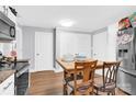 Kitchen with white cabinets, wood table and stainless steel appliances at 911 Elm St, Kannapolis, NC 28081