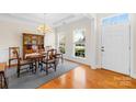 Formal dining room featuring hardwood floors and a wooden table set at 13026 Serenity St, Huntersville, NC 28078