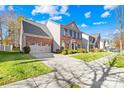 Two-story house with driveway and landscaping at 13026 Serenity St, Huntersville, NC 28078