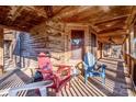 Relaxing covered porch with wooden chairs and scenic view at 148 Shawver Ln, Statesville, NC 28625