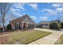 Charming home with landscaped yard and a welcoming front porch at 1608 Traditions Ct, Waxhaw, NC 28173