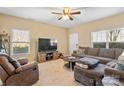 Living room with sectional sofa, TV, and recliner at 415 Kilberry Ln, Fort Mill, SC 29715