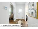 Hardwood floors and neutral colors highlight this welcoming entryway at 552 Zermatt Ct, Monroe, NC 28112