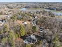 House nestled in a wooded area, near a lake with mountain views at 5774 Crown Ter, Hickory, NC 28601