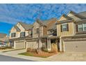 Three townhouses with brick and stone exterior at 6014 Cadence Ln, Fort Mill, SC 29707