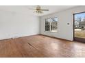 Living room with hardwood floors and large windows at 6439 Montpelier Rd, Charlotte, NC 28210