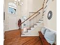 Bright entryway with hardwood floors and coat rack at 6700 Fairhope Ct, Charlotte, NC 28277