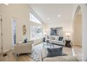 Spacious living room with large window and comfortable seating area at 7137 Windyrush Rd, Charlotte, NC 28226