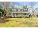 Beautiful two-story home with classic architecture, a large front porch, and a well-maintained lawn at 761 Summerwood Dr, Rock Hill, SC 29732