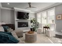 Living room with fireplace, large TV, comfortable seating, and hardwood floors at 7908 Rea View Ct, Charlotte, NC 28226