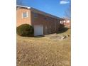 Brick house showcasing the back exterior and attached garage at 925 37Th Sw St, Hickory, NC 28602