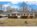 Charming brick ranch-style house featuring a covered entry and white trim accents at 925 37Th Sw St, Hickory, NC 28602