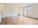 Bright living room with hardwood floors and large windows at 9835 Old Garden Cir, Gastonia, NC 28056