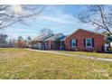 Ranch home with brick exterior, walkway, and a large yard at 116 Country Creek Dr, Kings Mountain, NC 28086