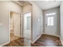 Bright entryway with hardwood floors, leading to a bathroom and bedroom at 123 Neill Estate Ln, Mooresville, NC 28117