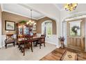 Formal dining room with hardwood floors and a chandelier at 13924 Island Dr, Huntersville, NC 28078