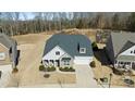 Aerial view of a house with a large backyard and neighborhood at 14206 Morningate St, Huntersville, NC 28078