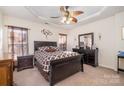 Main bedroom with ceiling fan and ensuite bathroom at 159 Kallie Loop, Mooresville, NC 28117