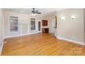 Hardwood floor living room, fireplace, and access to kitchen at 1610 Elkhart Cir, Gastonia, NC 28054