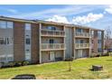 Brick condo building with balconies and ample green space at 1620 Arlyn Cir # G, Charlotte, NC 28213