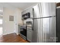 Modern kitchen featuring stainless steel appliances and granite countertops at 1620 #G Arlyn Cir, Charlotte, NC 28213