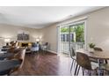 Bright living room featuring sliding glass doors to a balcony and modern furnishings at 1620 #G Arlyn Cir # G, Charlotte, NC 28213