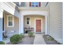 Inviting front entry with a red door and small patio at 206 River Clay Rd, Fort Mill, SC 29708